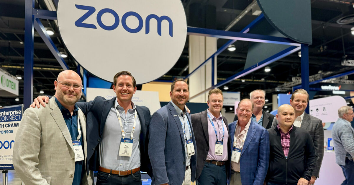 Journey team in front of Zoom sign and conference