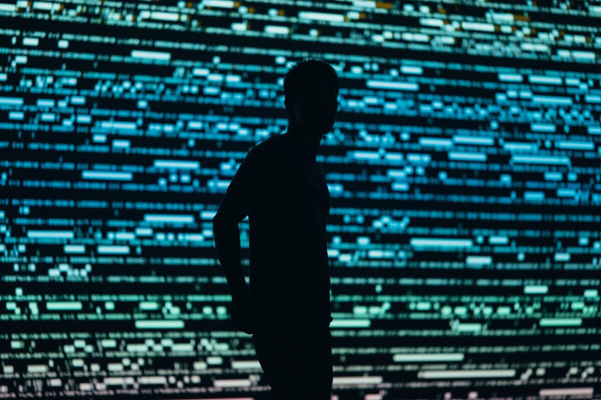 Person standing in front of brightlights
