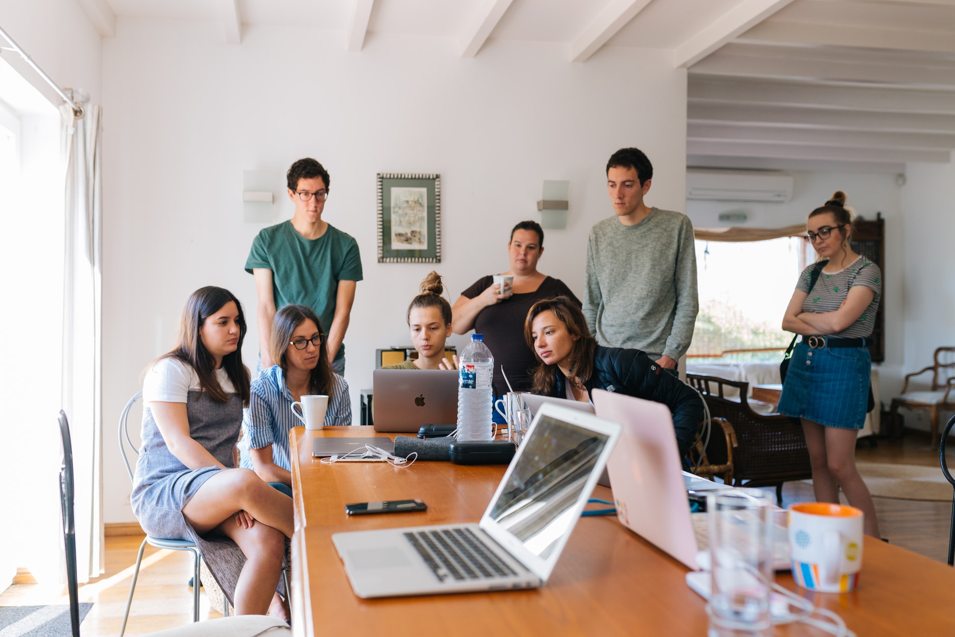 Group of people looking at laptop
