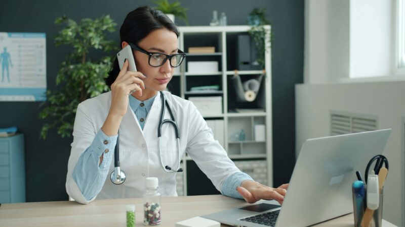 Healthcare worker on laptop