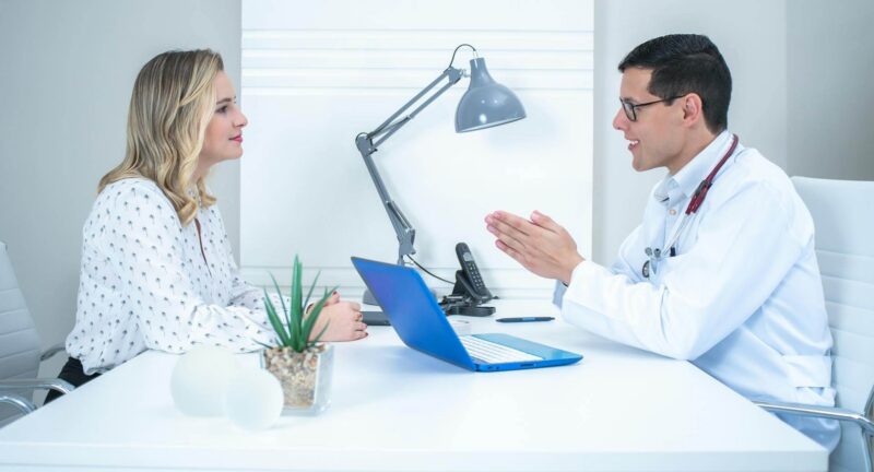 Healthcare provider and patient having a conversation