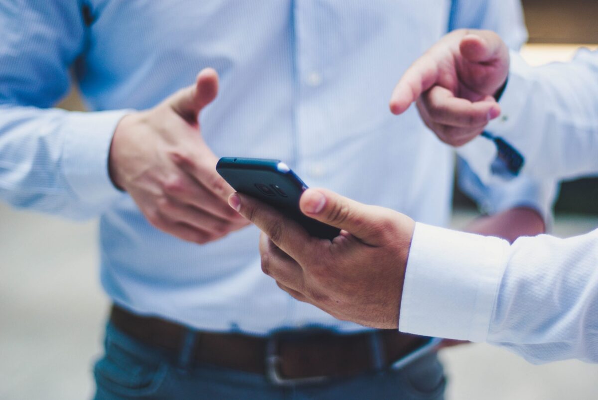 Two people looking at phone