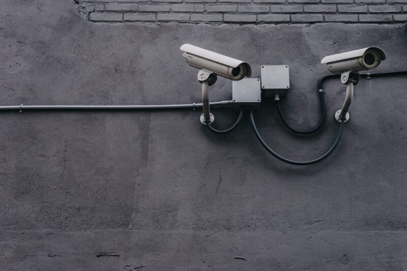 Security cameras on cement wall