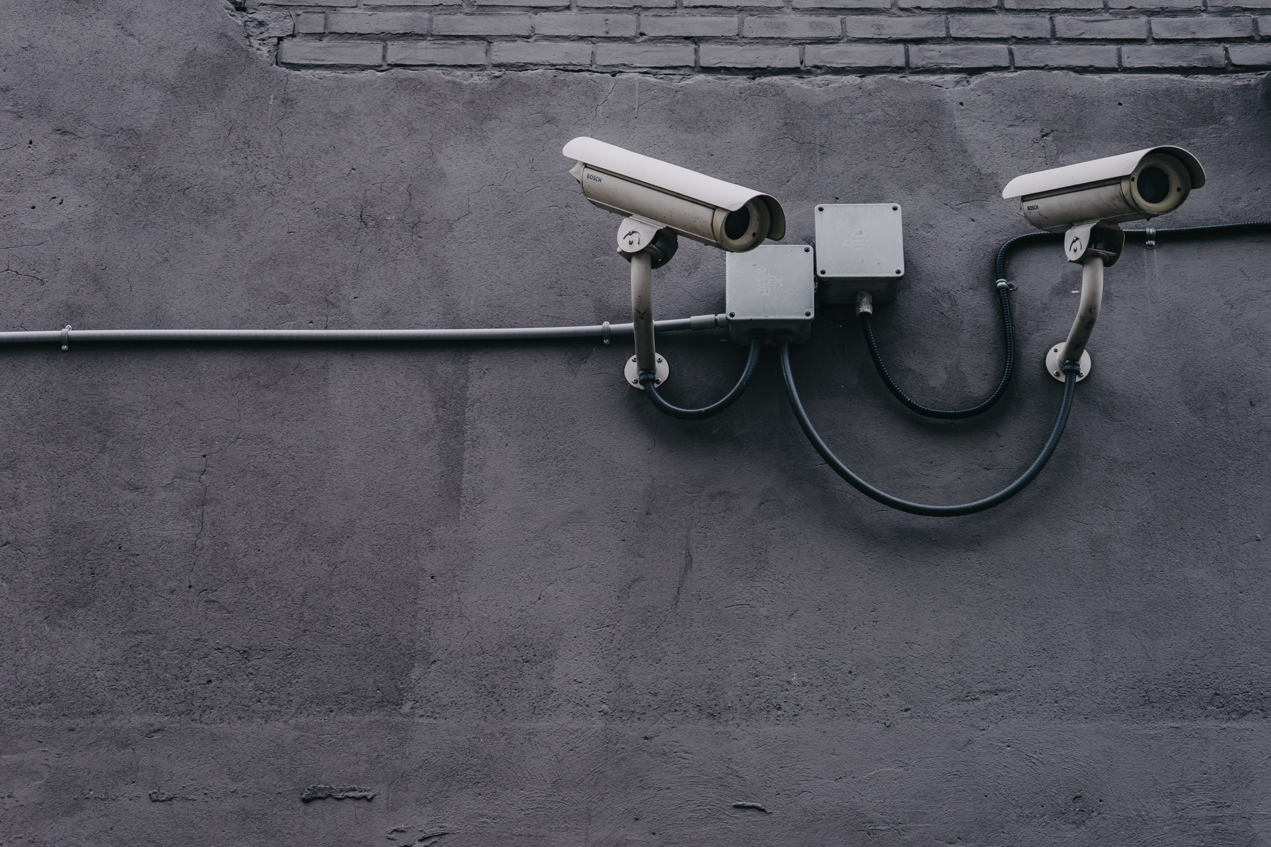 Security cameras on cement wall